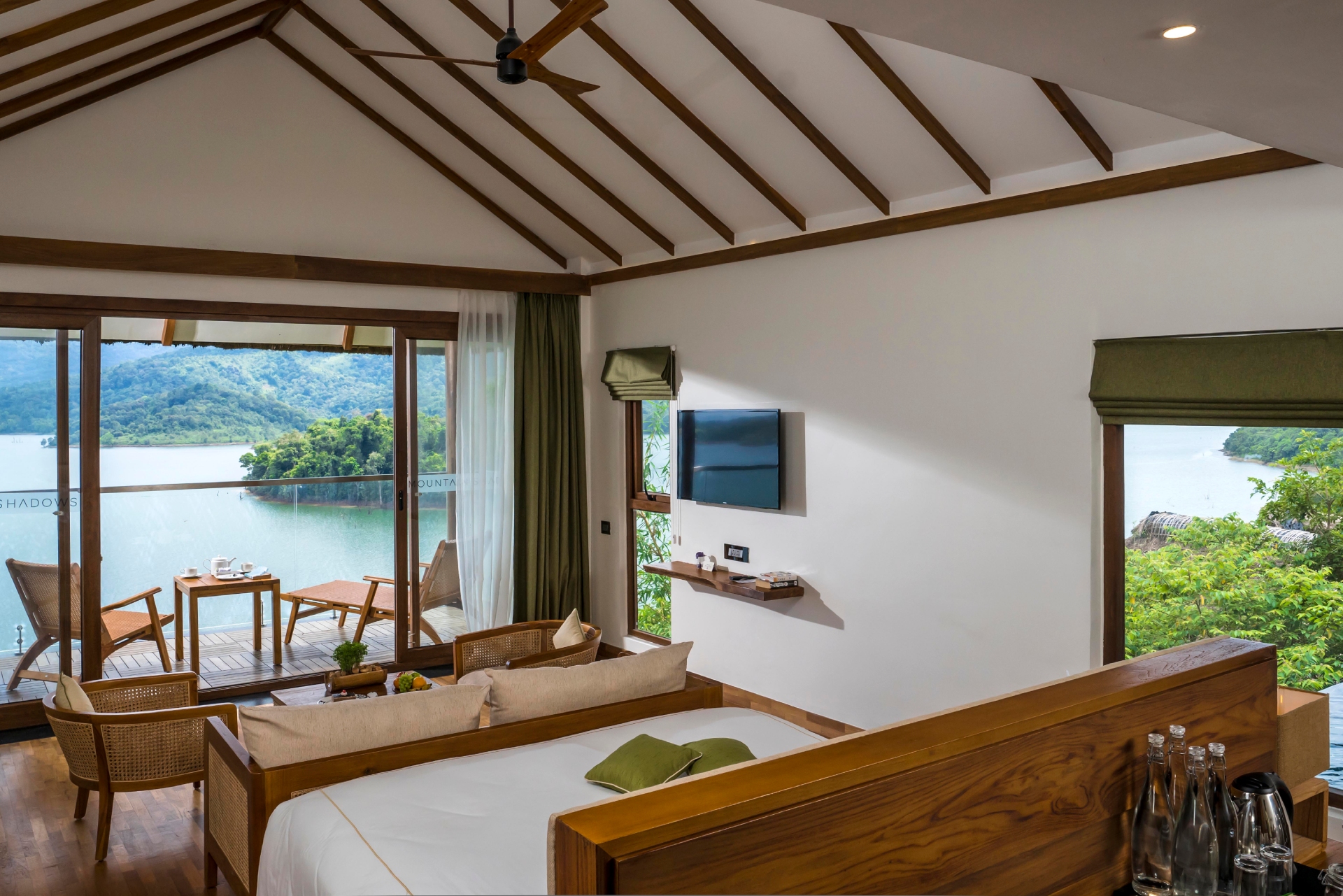 A view of the bedroom inside the private pool villa at Mountain Shadows resort in Wayanad