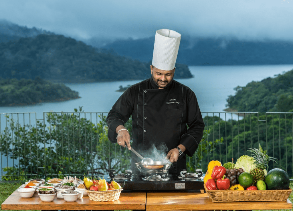 A chef demonstrating live cooking at a resort in Wayanad