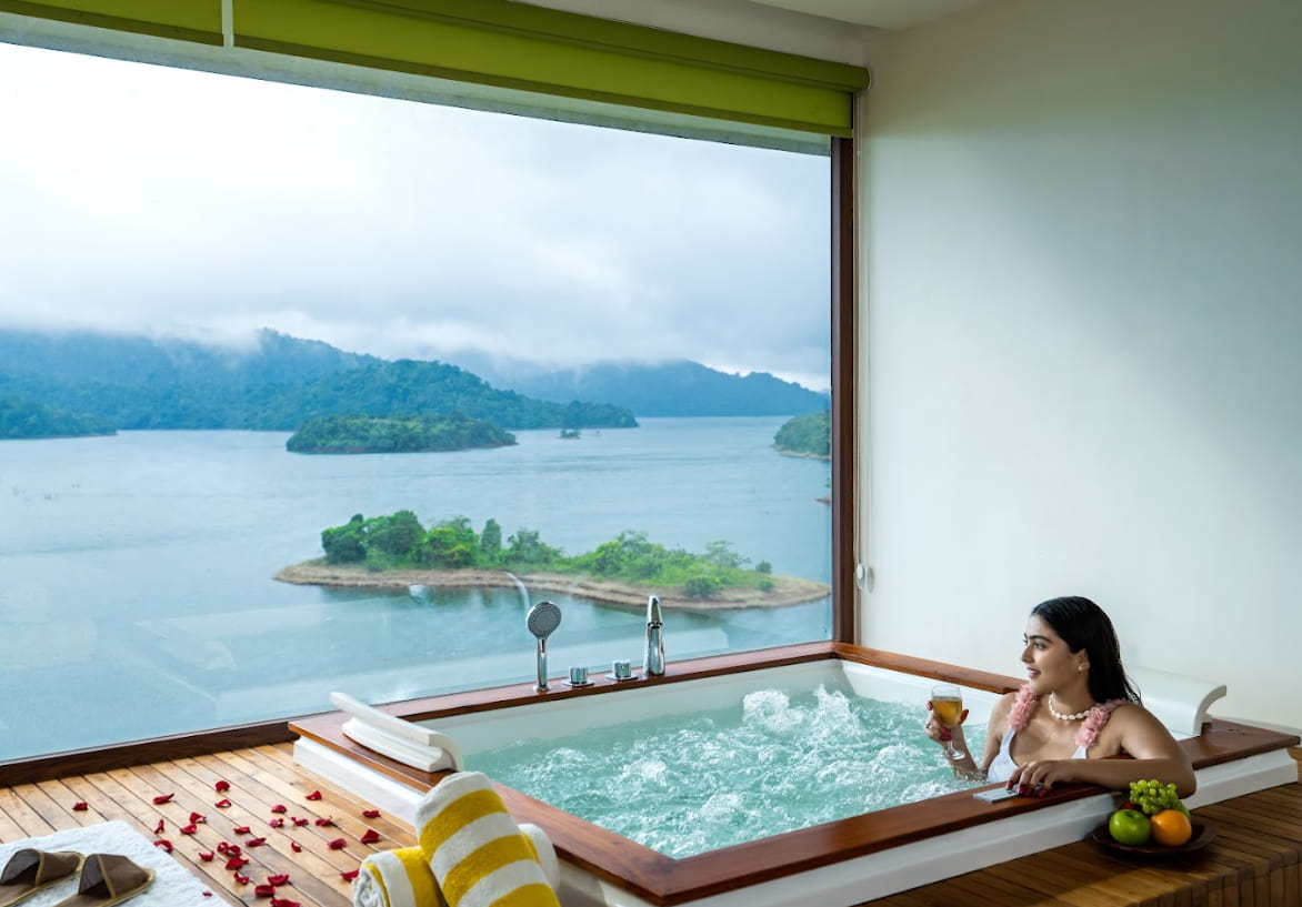 Woman relaxing in a jacuzzi villa in Wayanad at Mountain Shadows resort